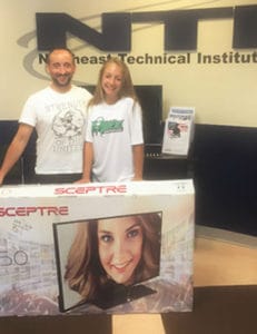 Rick Leslie and daughter win this years Summerfest raffle - a 50" Smart TV