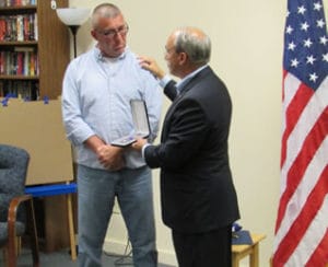 Congressman Bruce Poliquin Presents the Purple Heart to Northeast Technical Institute’s Mike Francis Purple Heart recipient Sgt. Michael Francis (left) with Congressman Poliquin at Friday’s ceremony.
